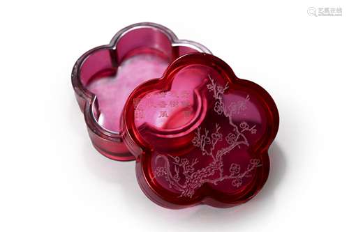 An inscribed plum blossom shaped red glass box