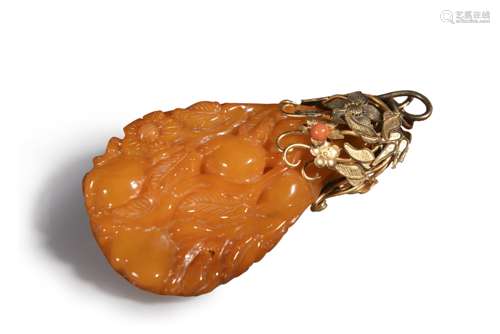 A carved amber pendant