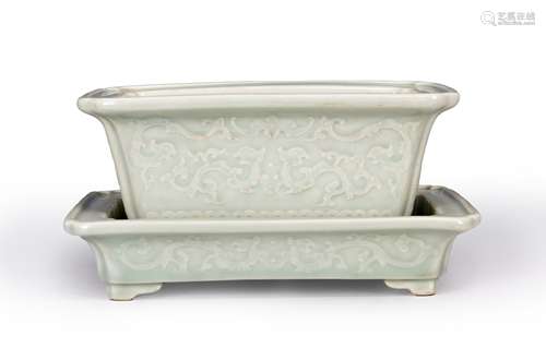 A carved celadon glazed porcelain flowerpot