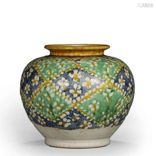 A tri-colored porcelain jar