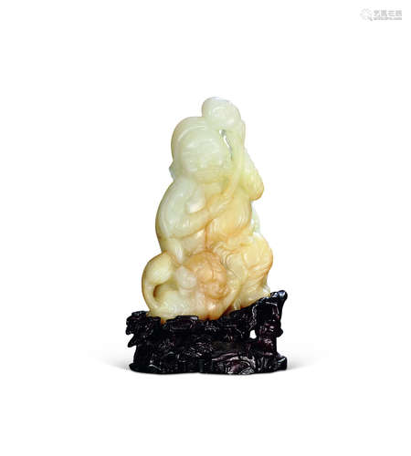 A white jade carved figure and lion ornament