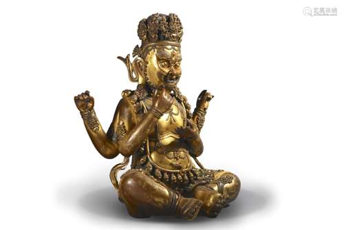 A copper four-armed Mahakala statue