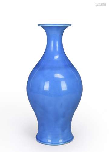 A peacock blue glazed porcelain olive-shaped vase