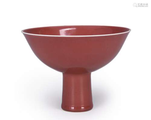 A red glazed porcelain stem bowl