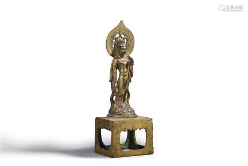 A gilding copper standing buddha statue