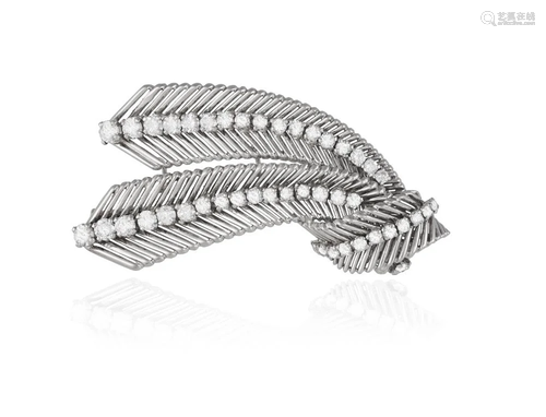 AN ELEGANT DIAMOND BROOCH, CIRCA 1950 Of stylised tied