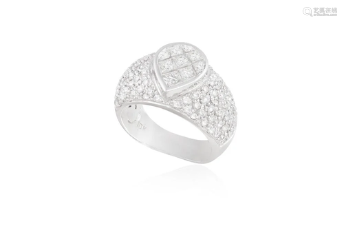 A DIAMOND DRESS RING Of bombé design, the central