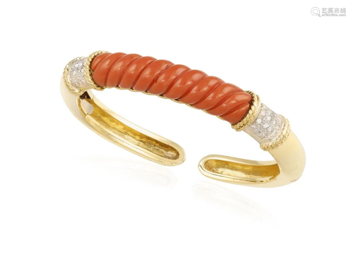 A CORAL AND DIAMOND BANGLE Composed of a central fluted