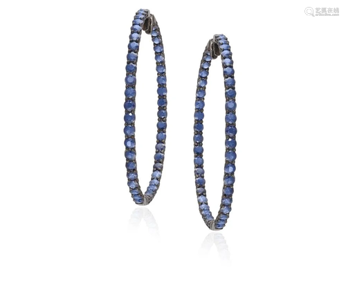 A PAIR OF SAPPHIRE HOOP EARRINGS Each set with a