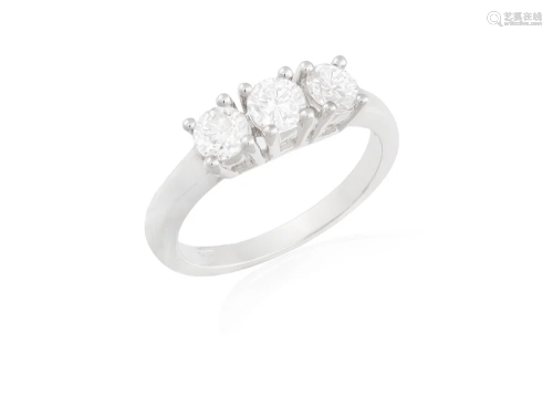 A DIAMOND THREE-STONE RING Composed of a trio of