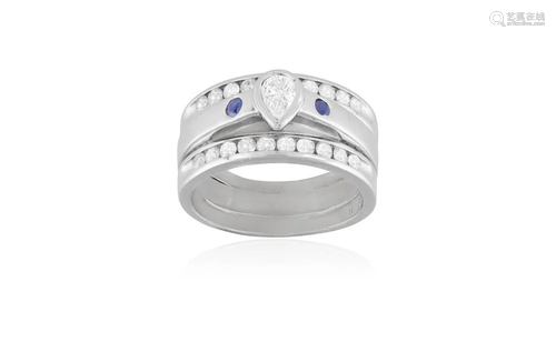 A DIAMOND AND SAPPHIRE DRESS RING The central