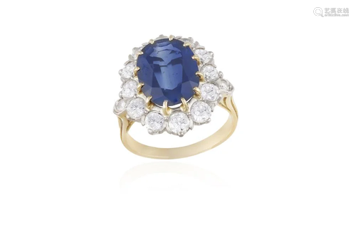 A SAPPHIRE AND DIAMOND CLUSTER RING The oval-shaped