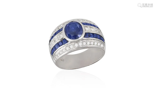 A SAPPHIRE AND DIAMOND RING Composed of an oval-shaped