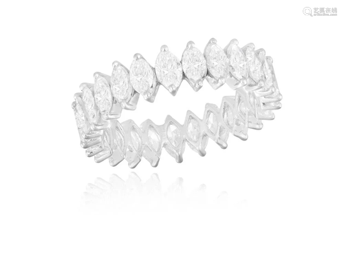 A DIAMOND ETERNITY RING Composed of a continuous row of