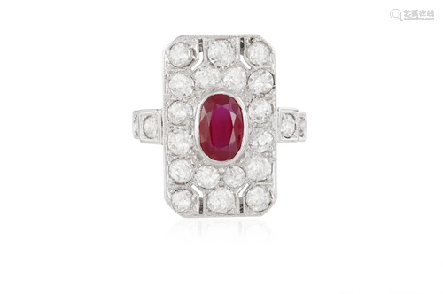 A RUBY AND DIAMOND RING The central oval-shaped ruby