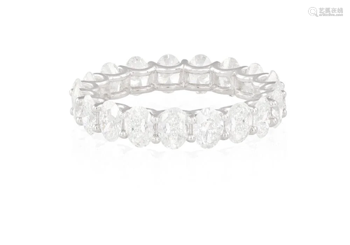 A DIAMOND ETERNITY RING The continuous row of