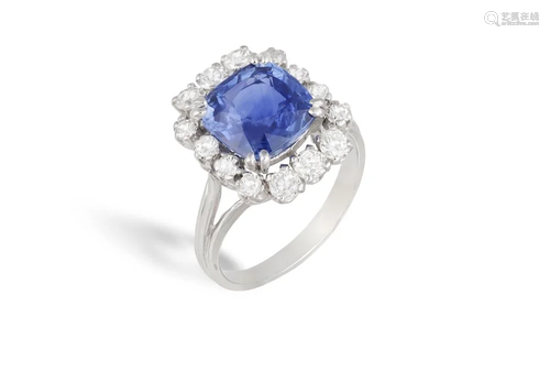 A SAPPHIRE AND DIAMOND CLUSTER RING Composed of a