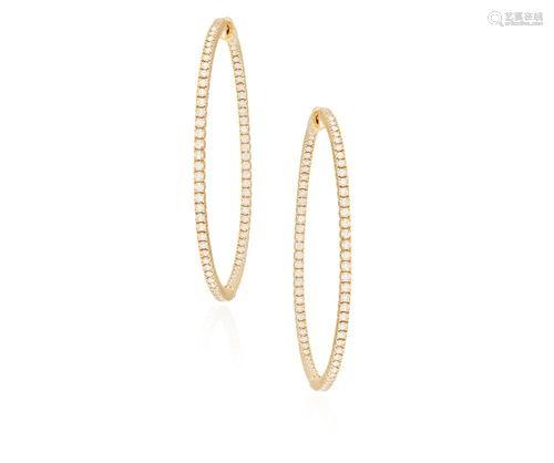 A PAIR OF DIAMOND HOOP EARRINGS Each hoop set with a