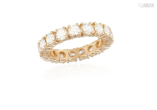 A DIAMOND ETERNITY RING Composed of a continuous row of