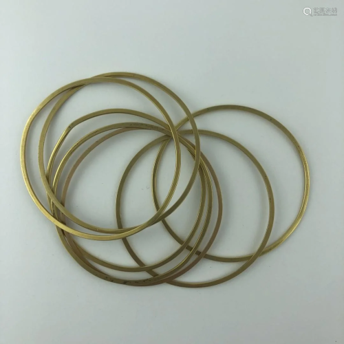 Seven 18 K gold bangle bracelets