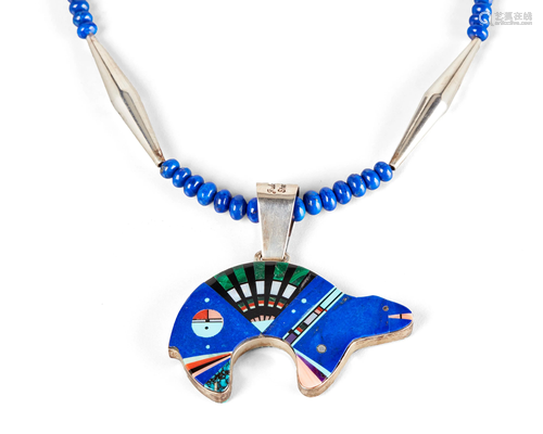 A Julian Arviso double-sided inlay bear pendant