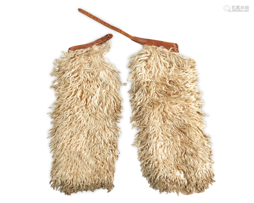 A pair of white wooly chaps