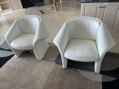 Pair of white modern leather arm chairs, label - made