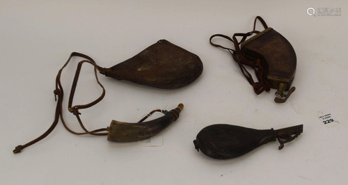 THREE EARLY GUN POWDER FLASKS TOGETHER WITH LEATHER