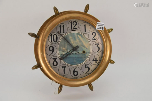 BRASS SHIP WHEEL CLOCK - with picture of sail boat at