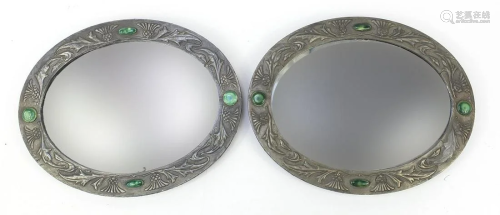 Manner of Liberty & Co, pair of Arts & Crafts oval wall