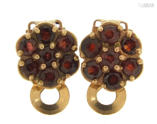 Pair of 9ct gold garnet flower head clip on earrings,