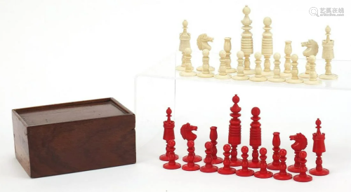 Carved bone half stained chess set with mahogany case,