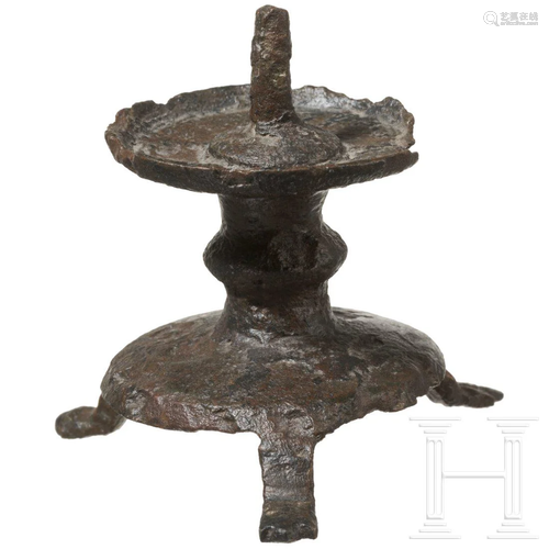 A small Flemish bronze pricket candlestick, late 13th