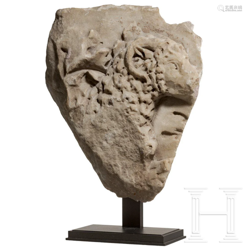 A Roman marble fragment with ram's head, late 3rd - 4th