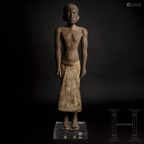 A masterful Egyptian wooden statuette of a high ranking