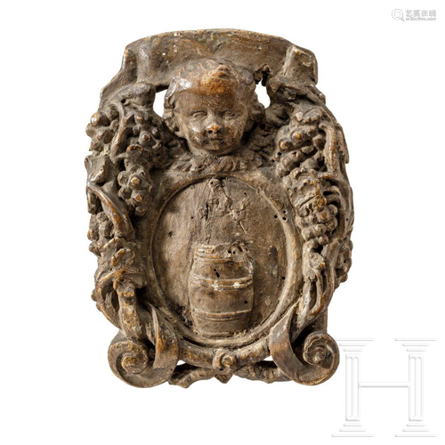 A carved baroque coat of arms with barrel from the