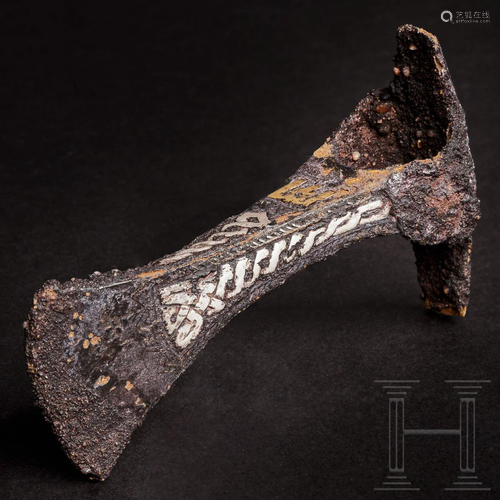 A Viking ceremonial axe with silver and gold inlays,