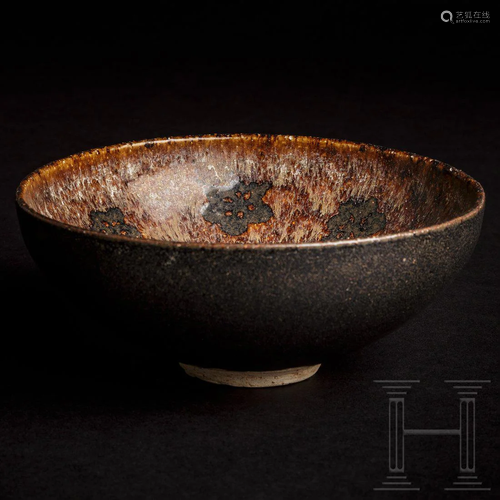 A rare Chinese Jizhou tea bowl with rosette decoration,