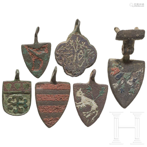 A group of English armorial harness pendants, 13th/14th