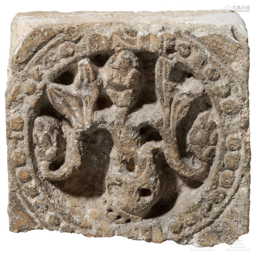 A fragment of a French Romanesque limestone frieze,