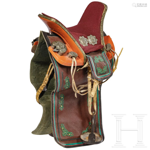 A richly decorated Sino-Tibetan saddle, 20th century