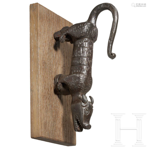 A northern Italian wrought iron doorknocker in animal