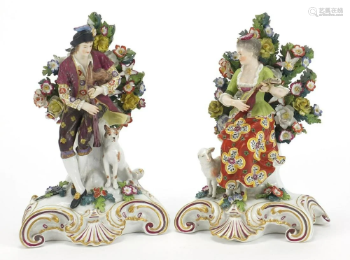 Pair of Chelsea style porcelain figures with dogs and