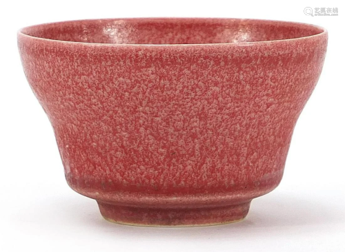 Chinese porcelain bowl having a pink glaze, six figure