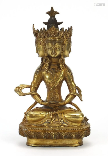 Chino Tibetan gilt bronze figure of four headed Buddha,