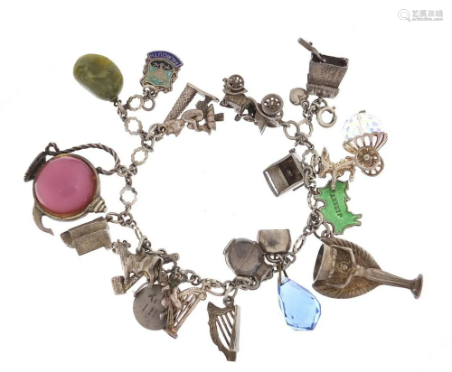 Silver charm bracelet with a large selection of charms
