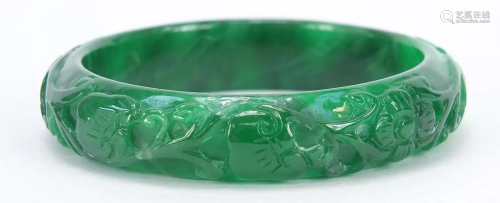 Chinese green jade bangle carved with dragons, 7.5cm in