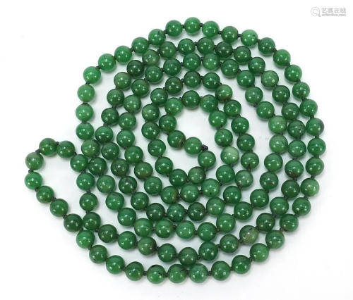 Chinese green jade bead necklace, 66cm in length