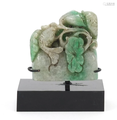 Chinese green jade carving of a fish and flowers on