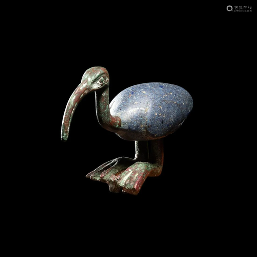 An Egyptian Bronze and Glass Ibis Height 2 1/2 inches.